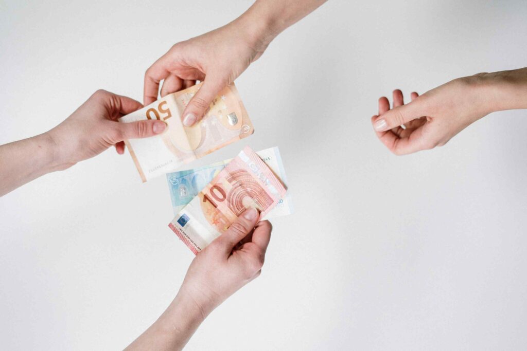 Digital Marketing's Absolute Necessity for Success in 2024 Unveiled | De Bie Media money exchanging hands referring to the extra profit you can get by using digital marketing