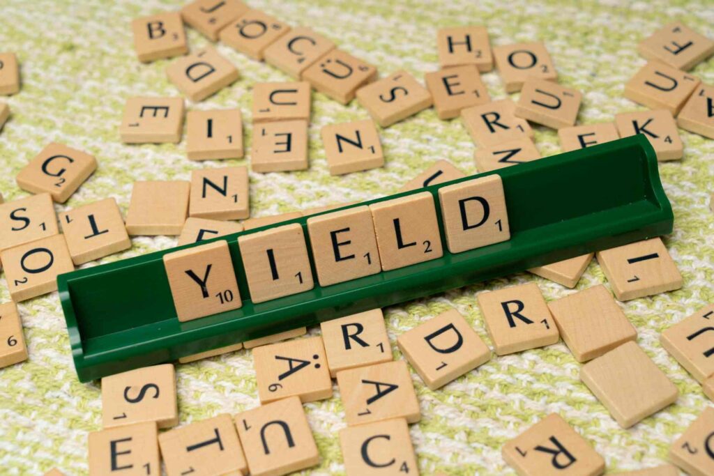 Digital Marketing's Absolute Necessity for Success in 2024 Unveiled | De Bie Media scrabble letters spelling out yield also referring to the extra yield digital marketing has
